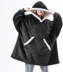 Dekenhoodie one size met fleece buitenkant en sherpa, kleur zwart - witte rand