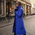 Lange damesmantel met knoopsluiting en opstaande kraag, kleur blauw